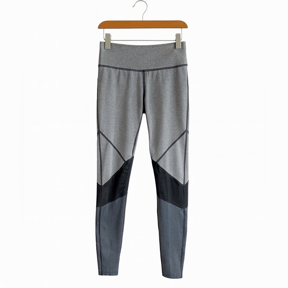 Yoga leggingsWomen’s size small black and gray . Mesh knees, back pocket.